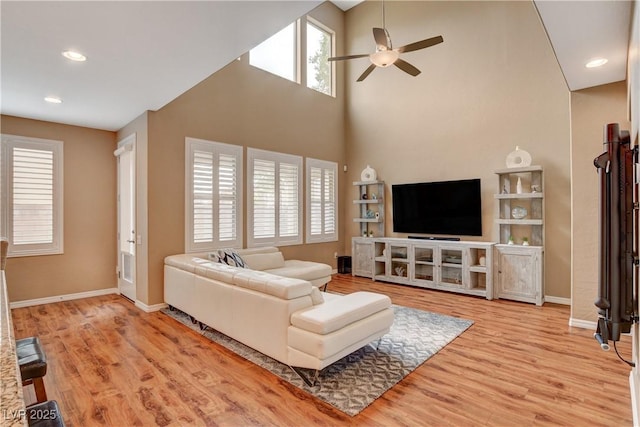 living room with recessed lighting, baseboards, light wood finished floors, and ceiling fan