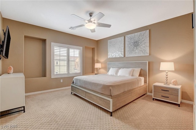 bedroom with visible vents, light colored carpet, a ceiling fan, and baseboards