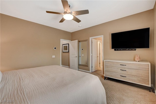 bedroom with light carpet and ceiling fan