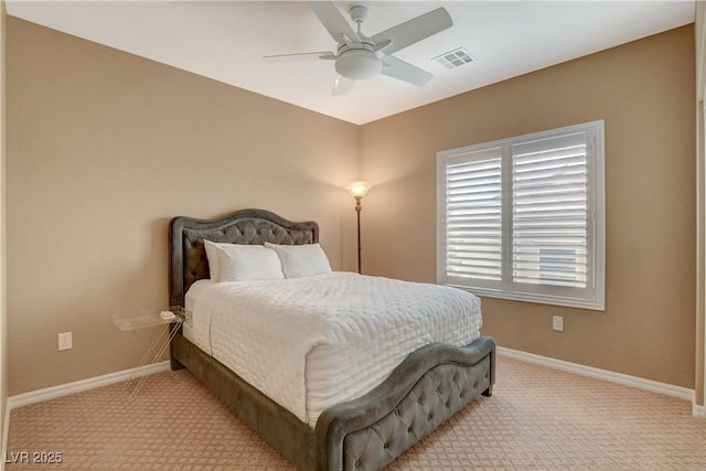 bedroom with light carpet, visible vents, a ceiling fan, and baseboards