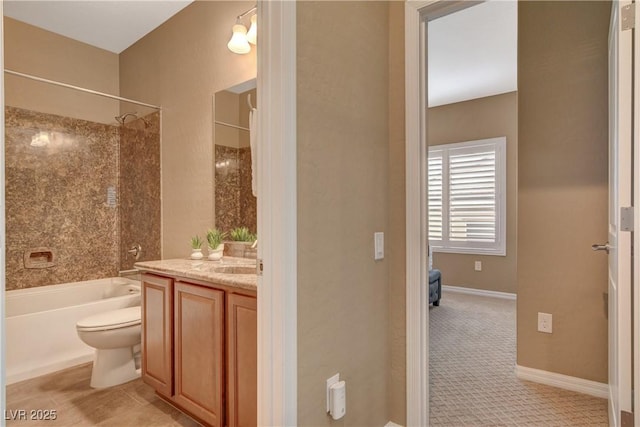 full bath featuring shower / bathing tub combination, baseboards, toilet, and vanity