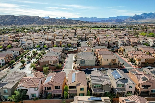 birds eye view of property featuring a mountain view and a residential view