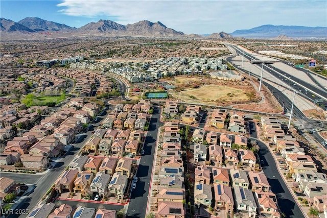 drone / aerial view with a residential view and a mountain view