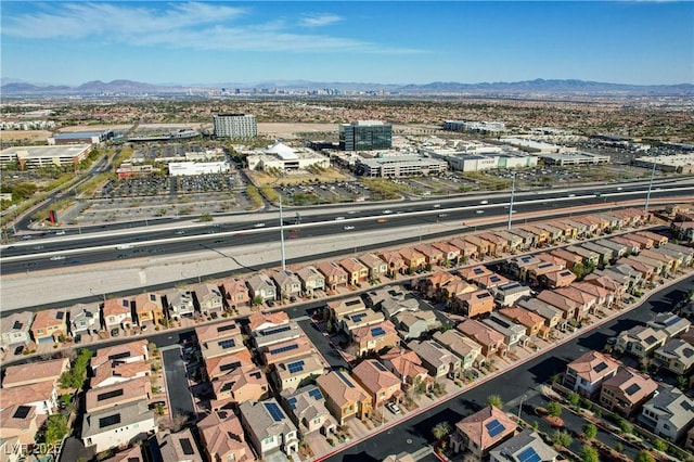 drone / aerial view featuring a residential view and a mountain view