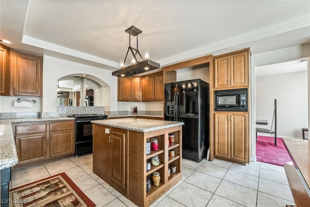 kitchen featuring a kitchen island, light tile patterned floors, arched walkways, black appliances, and open shelves