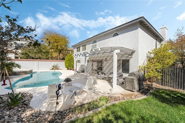 back of property featuring stucco siding, a pergola, a patio, a fenced backyard, and a fenced in pool