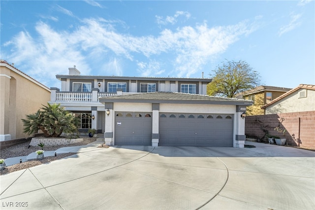 view of front of home featuring stucco siding, driveway, fence, a garage, and a balcony