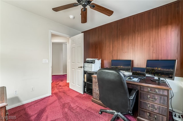 home office with baseboards, carpet floors, and a ceiling fan