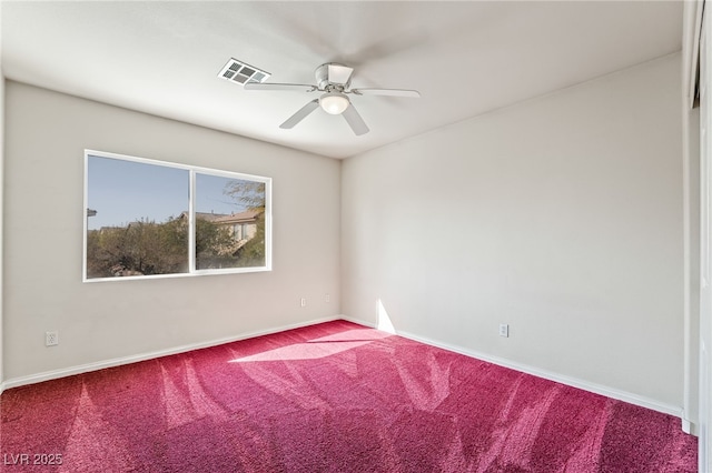 carpeted empty room featuring visible vents, baseboards, and ceiling fan