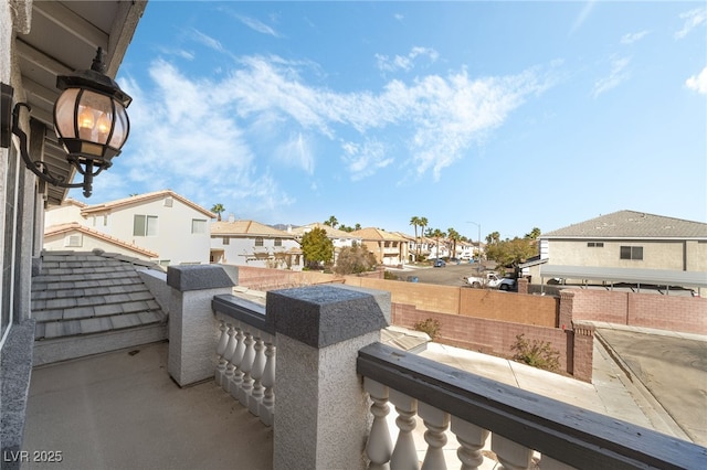 view of patio / terrace featuring a balcony and a residential view