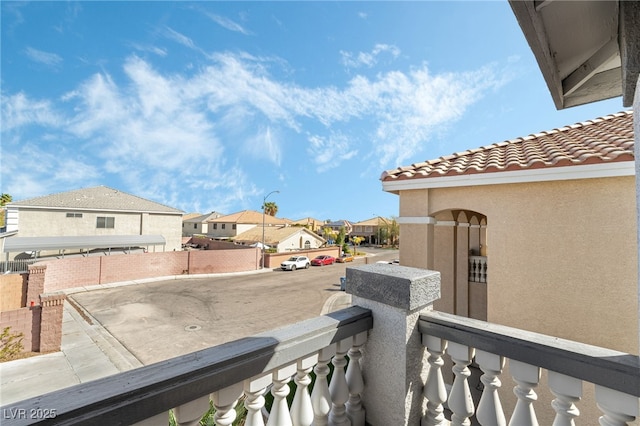 exterior space with a balcony and a residential view