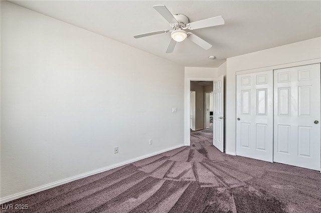 unfurnished bedroom with ceiling fan, carpet floors, a closet, and baseboards