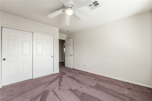 unfurnished bedroom featuring a closet, ceiling fan, baseboards, carpet flooring, and visible vents