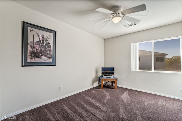 unfurnished room with carpet floors, a ceiling fan, visible vents, and baseboards