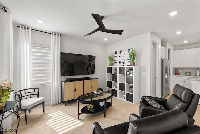 living area featuring light tile patterned floors, ceiling fan, and recessed lighting