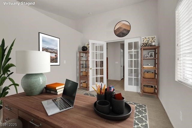 office area featuring french doors and light colored carpet