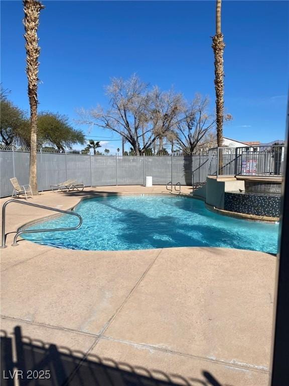 view of pool featuring a patio, fence, and a fenced in pool