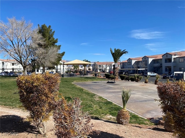 view of home's community with a yard, a residential view, and a gazebo