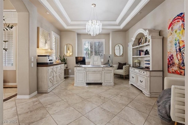 office area featuring baseboards, a tray ceiling, a chandelier, and ornamental molding