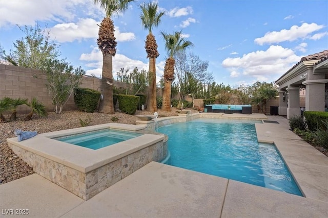 outdoor pool featuring a fenced backyard, a patio, and an in ground hot tub