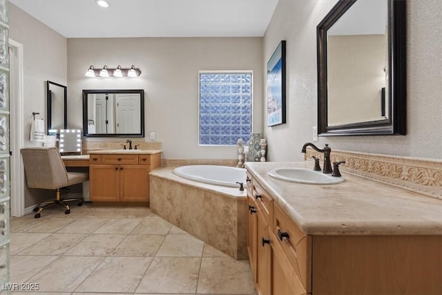 bathroom featuring a bath, tile patterned flooring, two vanities, and a sink