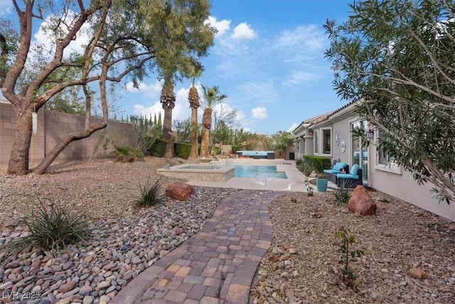 view of yard with a patio area, a fenced backyard, and an outdoor pool