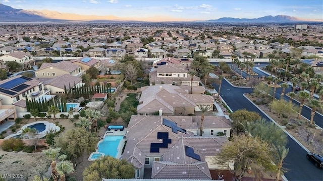 aerial view at dusk with a residential view and a mountain view