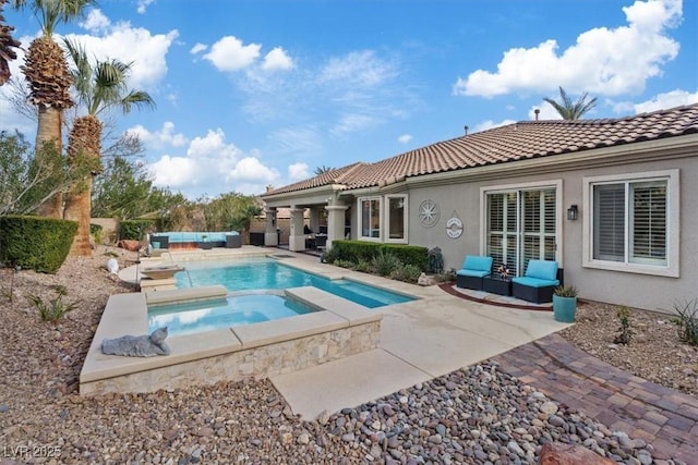 view of swimming pool with a patio area, an outdoor hangout area, and an in ground hot tub