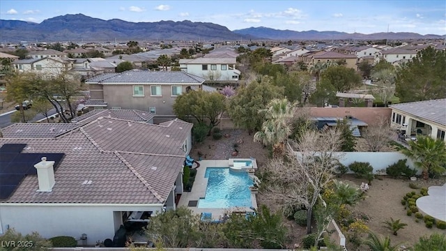 birds eye view of property with a residential view and a mountain view