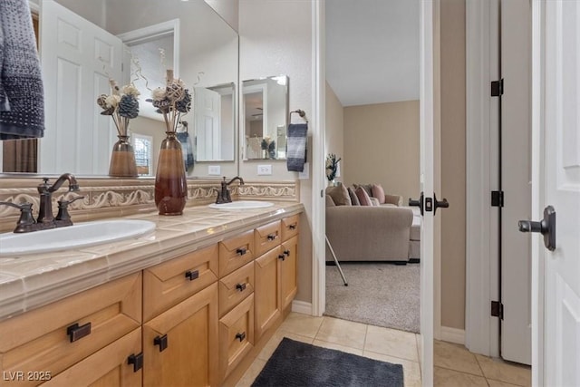 full bathroom featuring tile patterned flooring, a sink, and double vanity