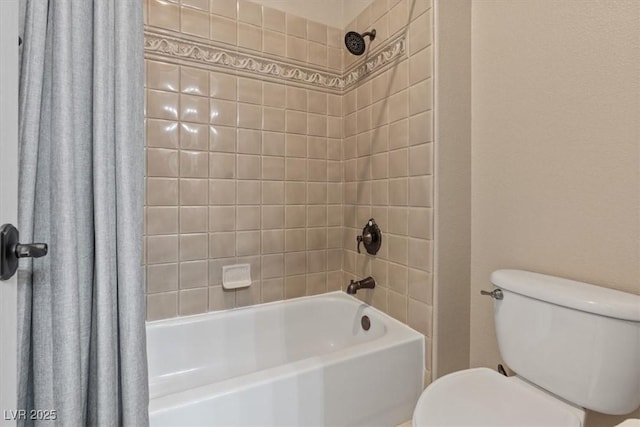 bathroom featuring shower / bath combination with curtain and toilet