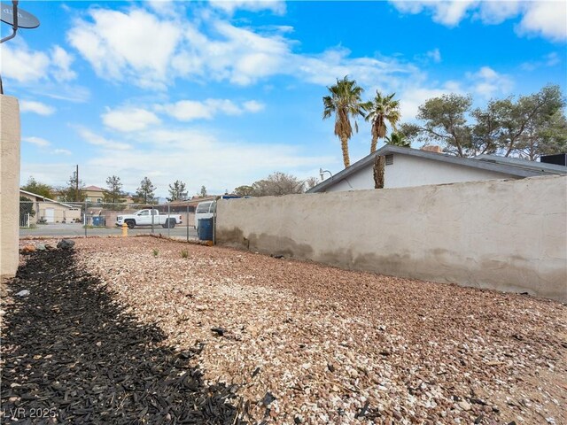 view of yard with a gate and fence