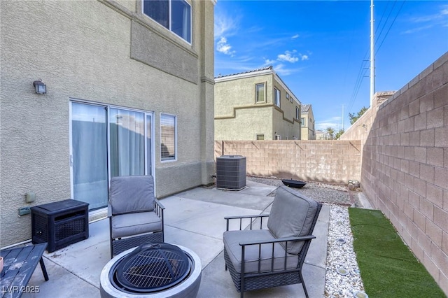 view of patio featuring a fenced backyard and central AC unit