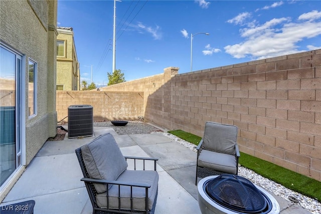 view of patio / terrace with a fenced backyard and central AC unit