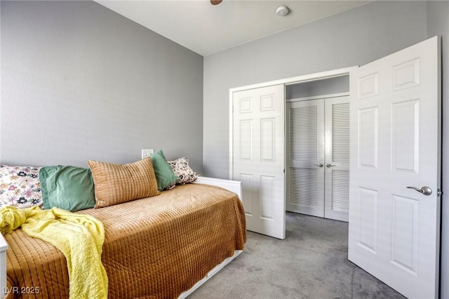 carpeted bedroom with a closet