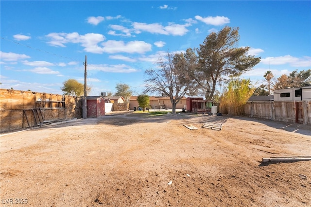 view of yard with a gate and fence