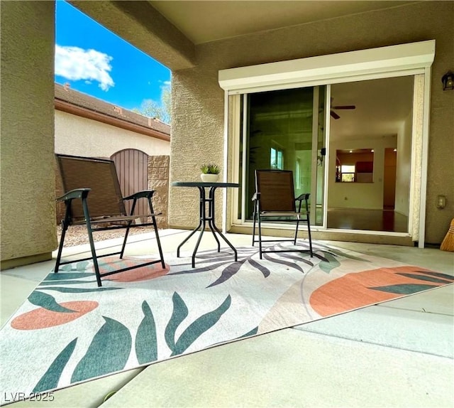 view of patio with a gate