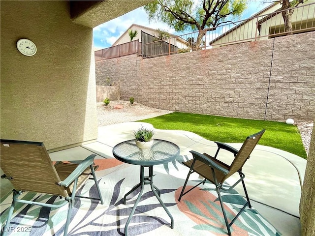 view of patio with fence