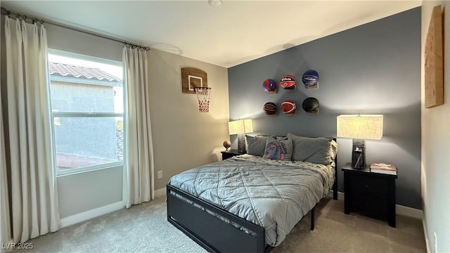 carpeted bedroom with baseboards