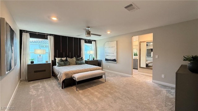 bedroom featuring visible vents, light carpet, baseboards, and multiple windows