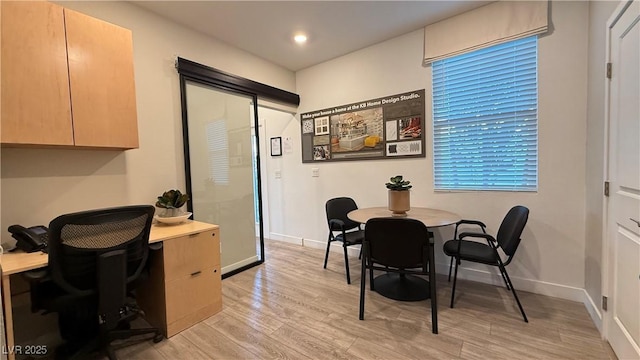 home office with recessed lighting, baseboards, and light wood finished floors