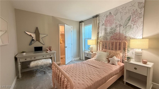 carpeted bedroom featuring baseboards