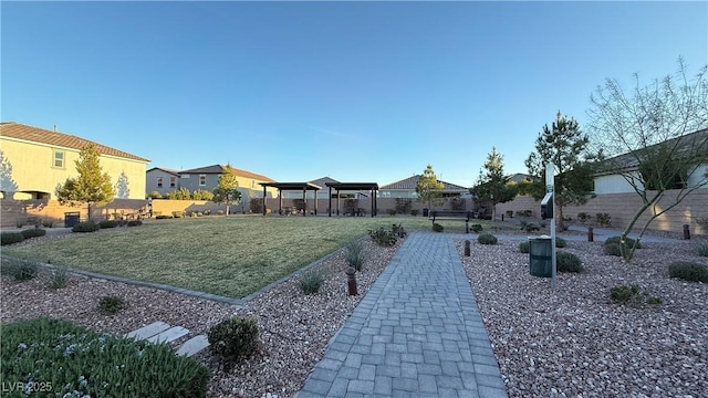 view of yard featuring fence and a gazebo