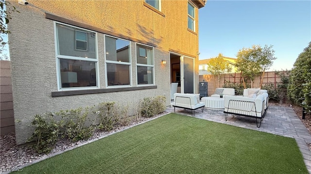 exterior space featuring a patio, fence, and an outdoor living space