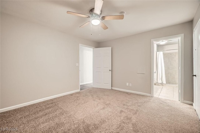 interior space with ceiling fan, carpet, and baseboards