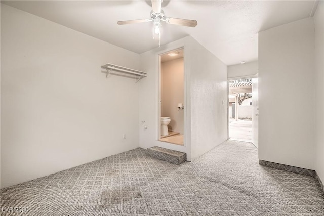 spare room with ceiling fan and carpet flooring