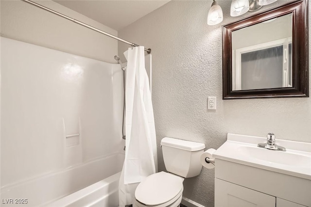 full bath featuring toilet, vanity, shower / bath combo with shower curtain, and a textured wall