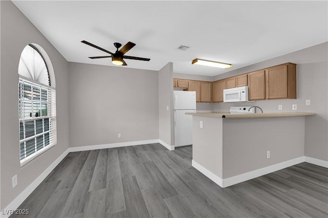 kitchen with white appliances, baseboards, visible vents, dark wood-style flooring, and light countertops