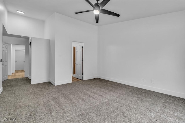 unfurnished bedroom featuring baseboards, carpet floors, and ceiling fan