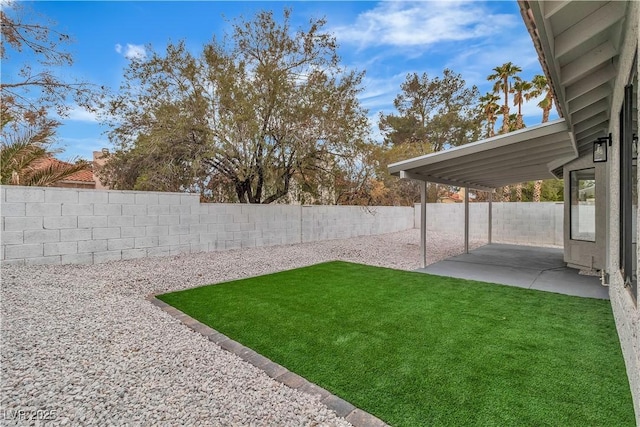 view of yard featuring a patio and a fenced backyard